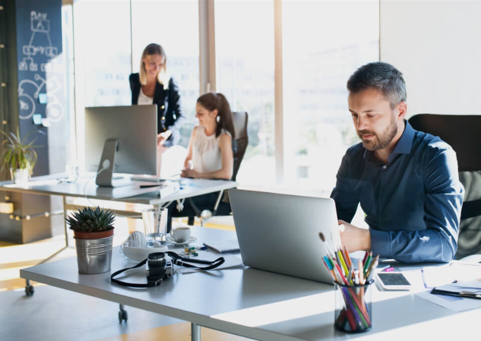 Office Workers with Laptops